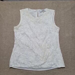 White lacy top over white material, size large. Very pretty & versatile.